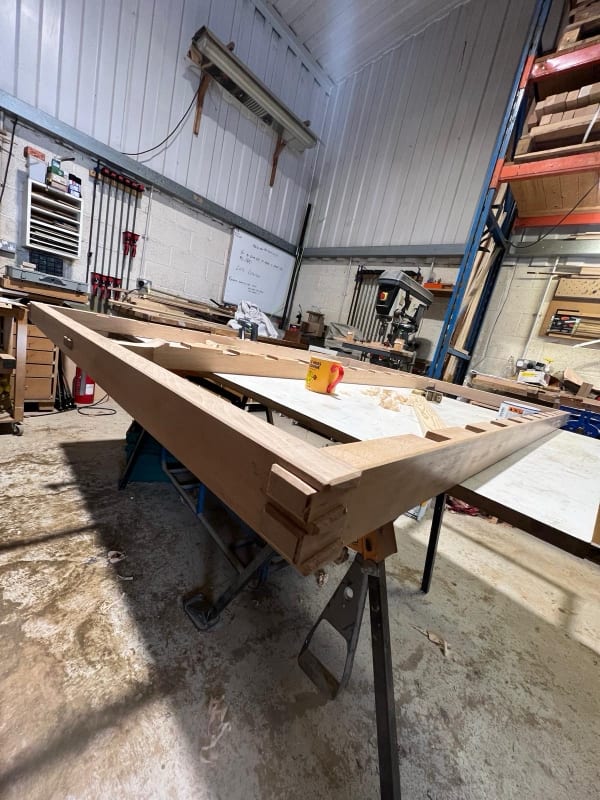 Bespoke table with turned legs taking shape in the workshop